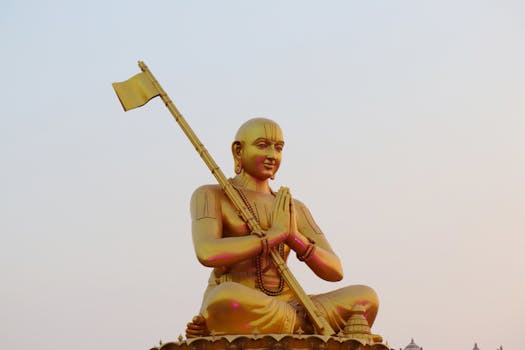The majestic golden statue of Hindu philosopher Ramanuja, a serene outdoor view.